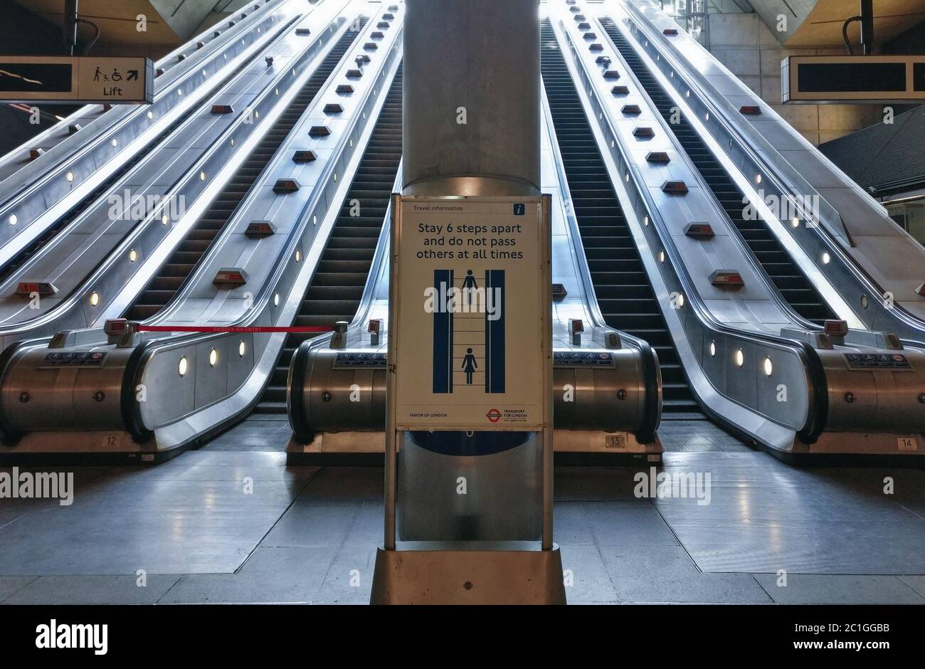 London, United Kingdom - June 14, 2020: Advisory sign prompting people to stand apart and practice social distancing when using escalators in London u Stock Photo