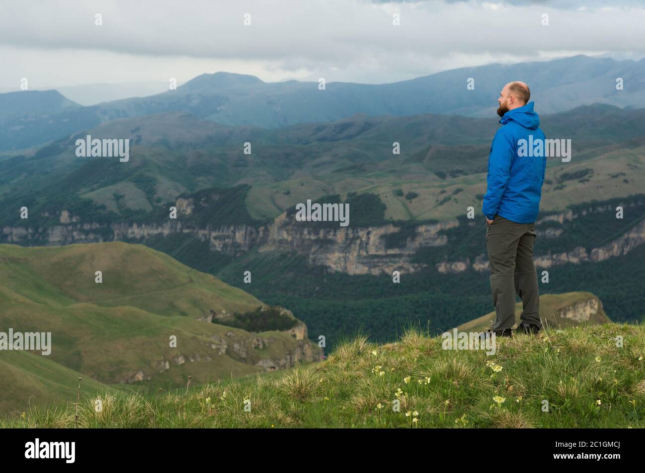 Rugged bearded man in in a membrane jacket headshot country masculine midwest mountain male Stock Photo