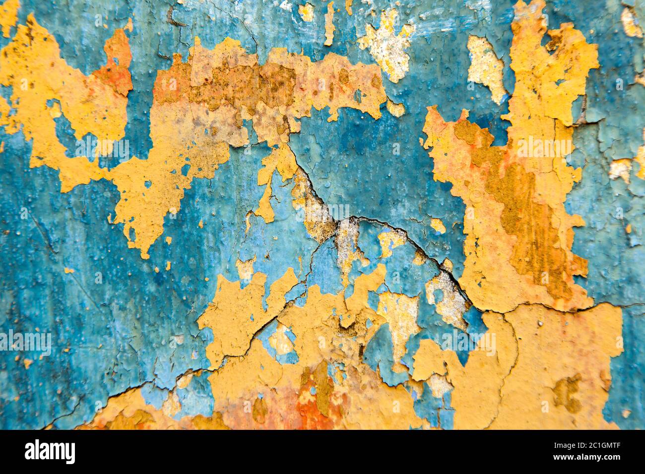 Old painted wall - Blue and yellow texture Stock Photo