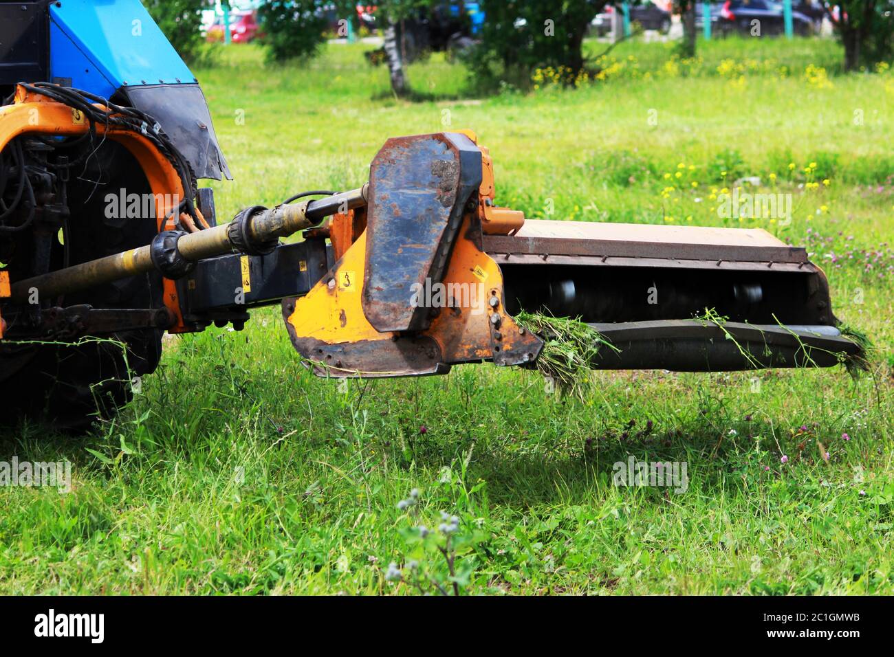 nozzle on a tractor that mows grass on urban lawns. Stock Photo