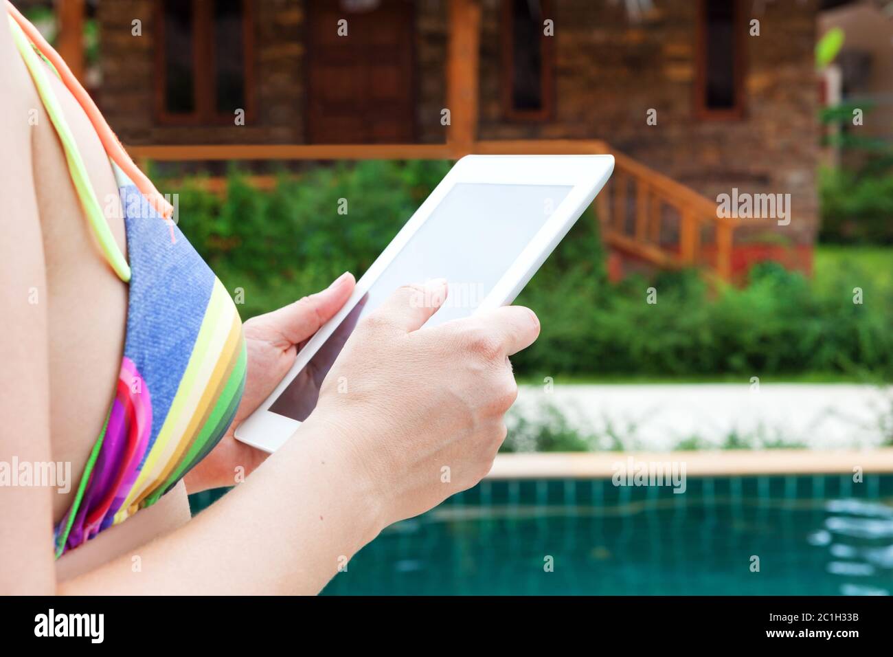 Woman in bikini with tablet Stock Photo Alamy