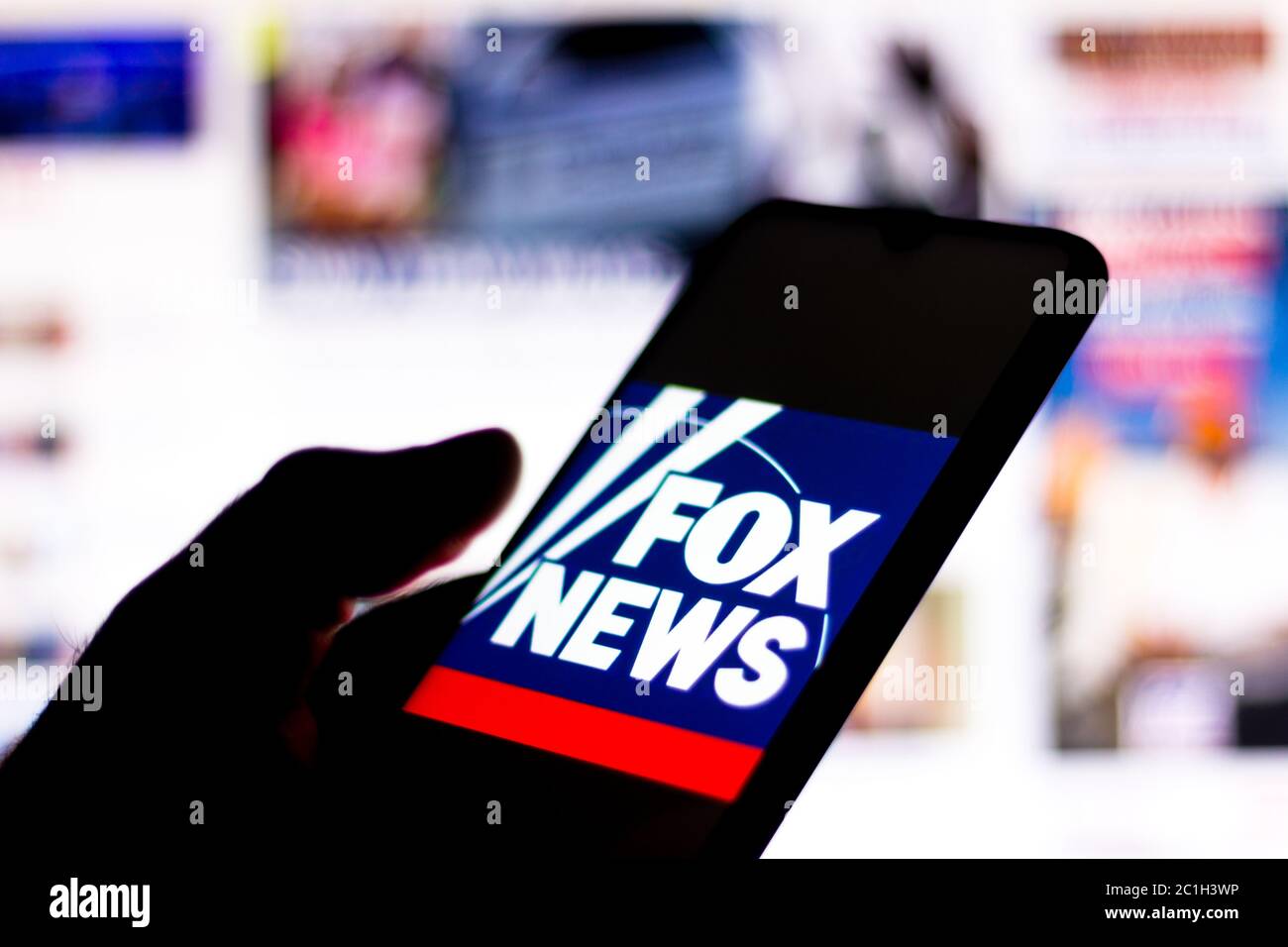 In this photo illustration the Fox News Channel logo seen displayed on a smartphone. Stock Photo
