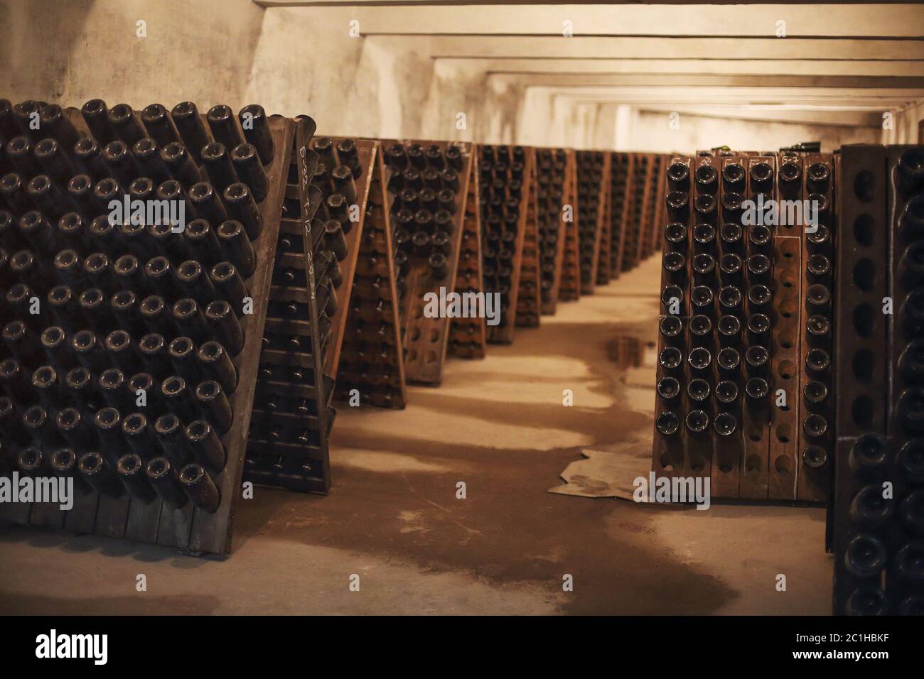 Sparkling wine glass bottles in winery Stock Photo - Alamy