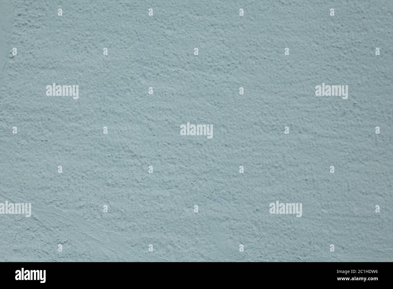 The texture of a roughly plastered wall with a bluish-dirty hue. Stock Photo