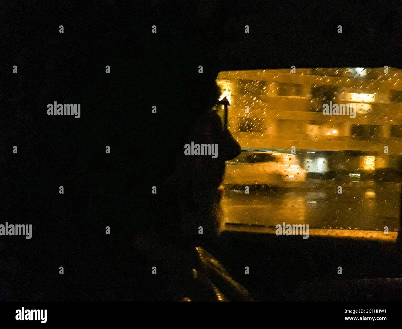 Man Watching Through Car Window Glass Stock Photo