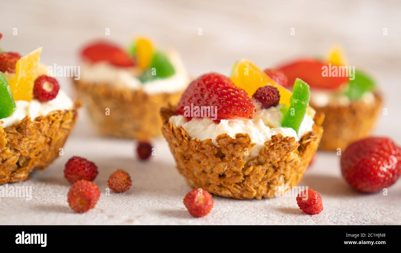 Healthy food and diet concept. Oatmeal backed cups with yogurt and berries. Weekend breakfast. Delicious food at home Stock Photo