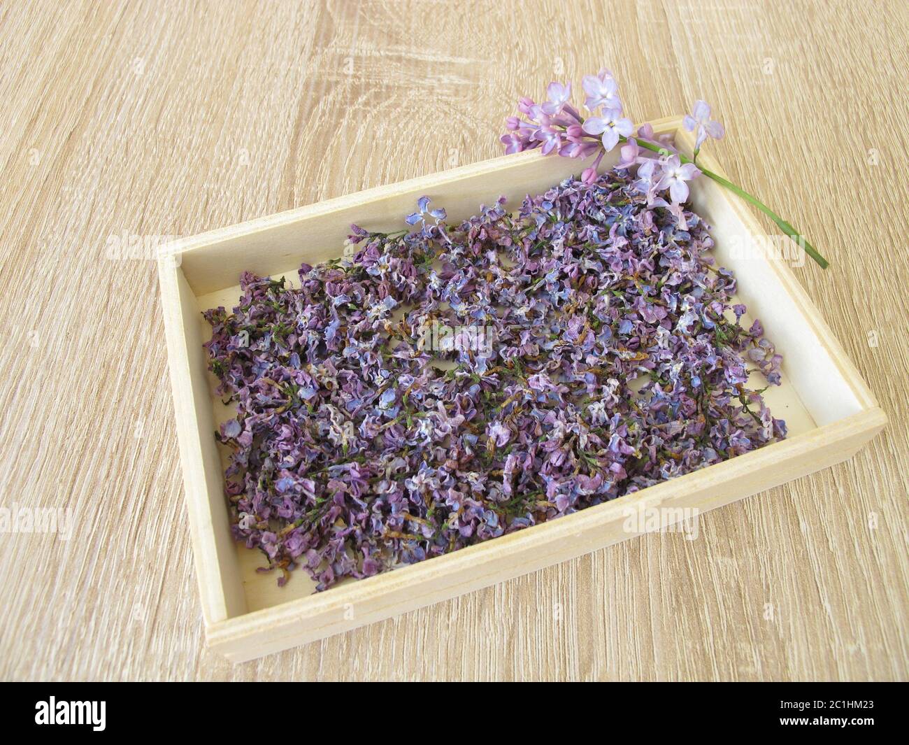 Dried lilac flowers in wooden box Stock Photo Alamy
