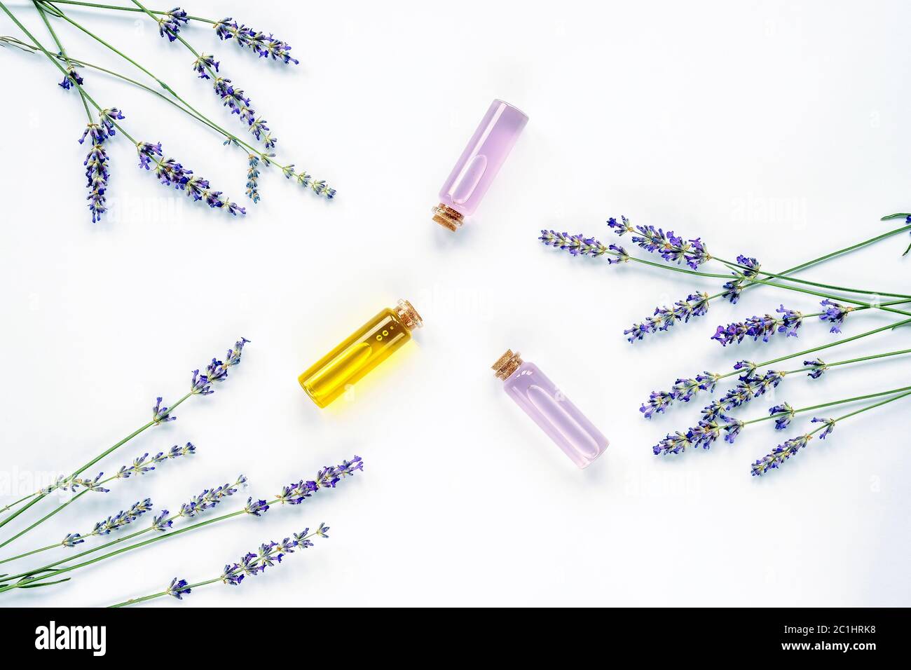 Lavender blossom, glass bottles with extract and essential oil on white ...
