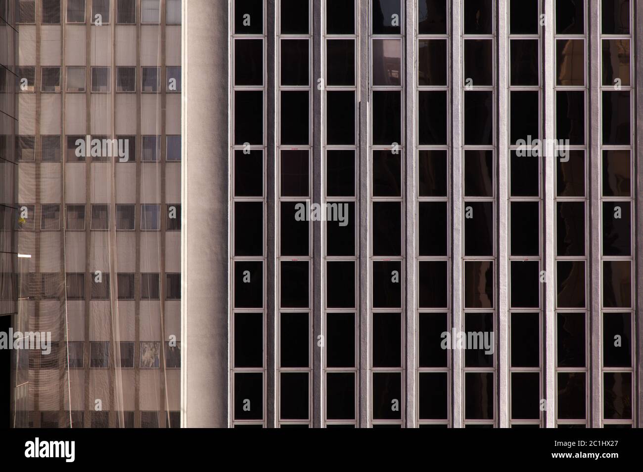 Modern glass windows in concrete building facade - urban modern ...