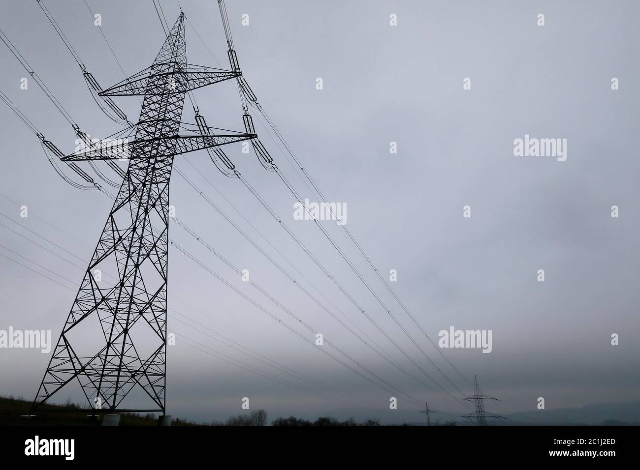 Power line and power pylons for energy transport Stock Photo