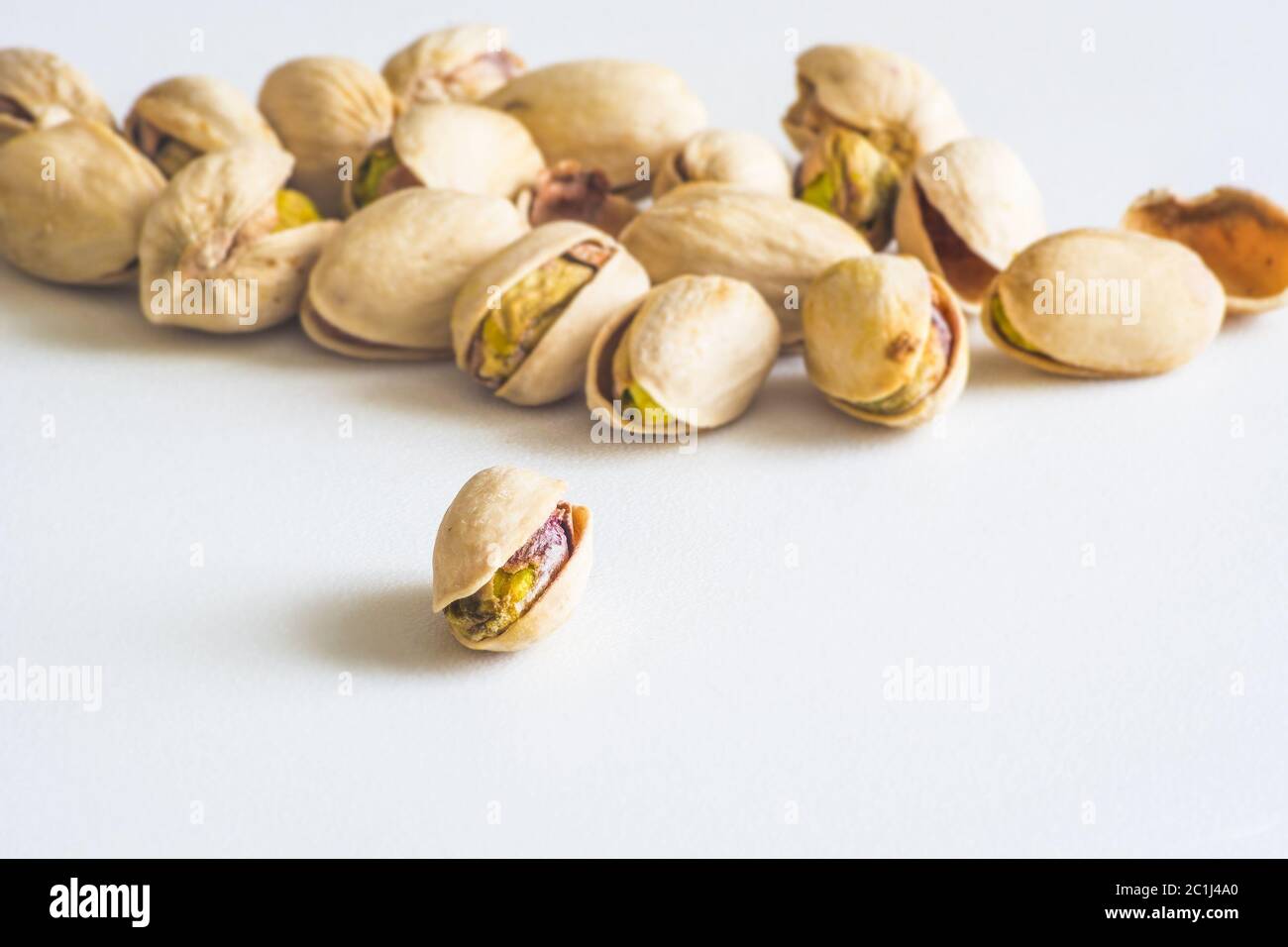 Close Up Group Of Dry, Fresh And Large Raw Pistachio Nuts In Shell