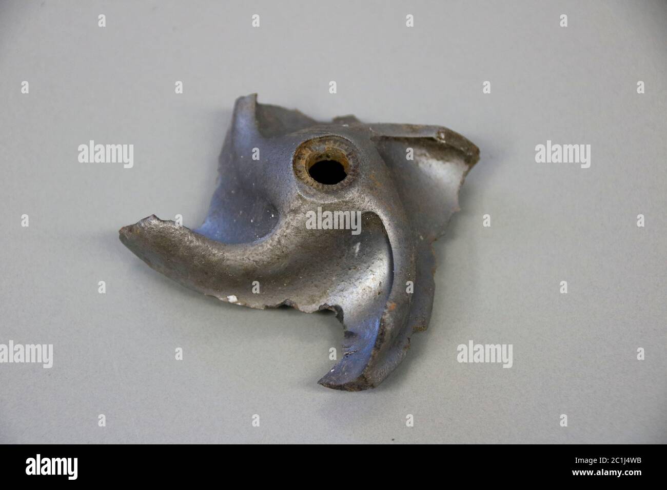 Impeller of a water pump. The impeller is heavily worn by stones ...