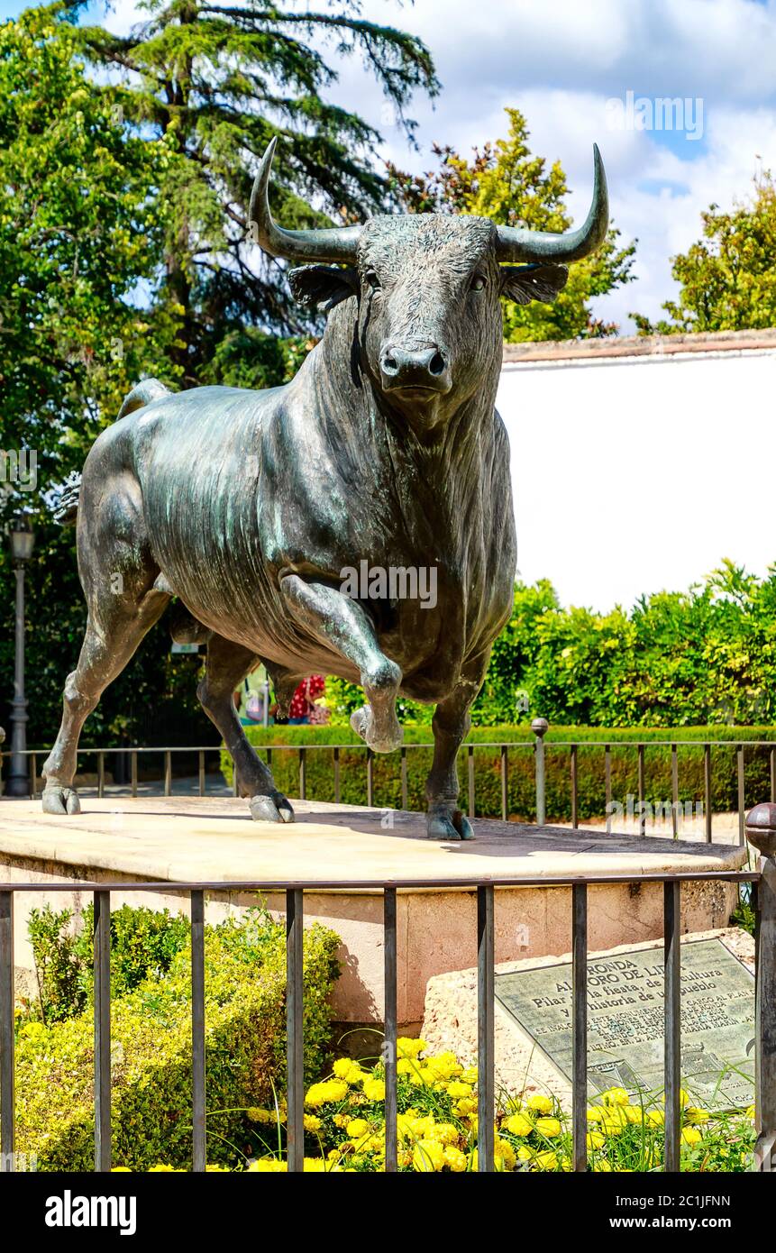 Bull sculpture - Main entrance to bullring - Plaza des Toros in historic fortress town, Rondaâ€“ near Malaga, Andalusia, Spain Stock Photo