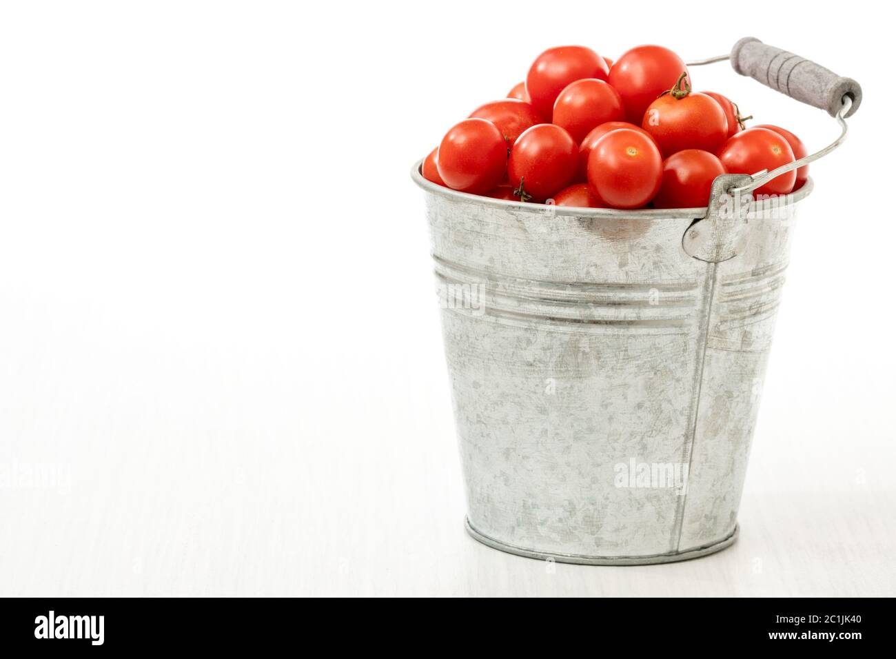 Metal bucket full of organic tomatoes Stock Photo Alamy