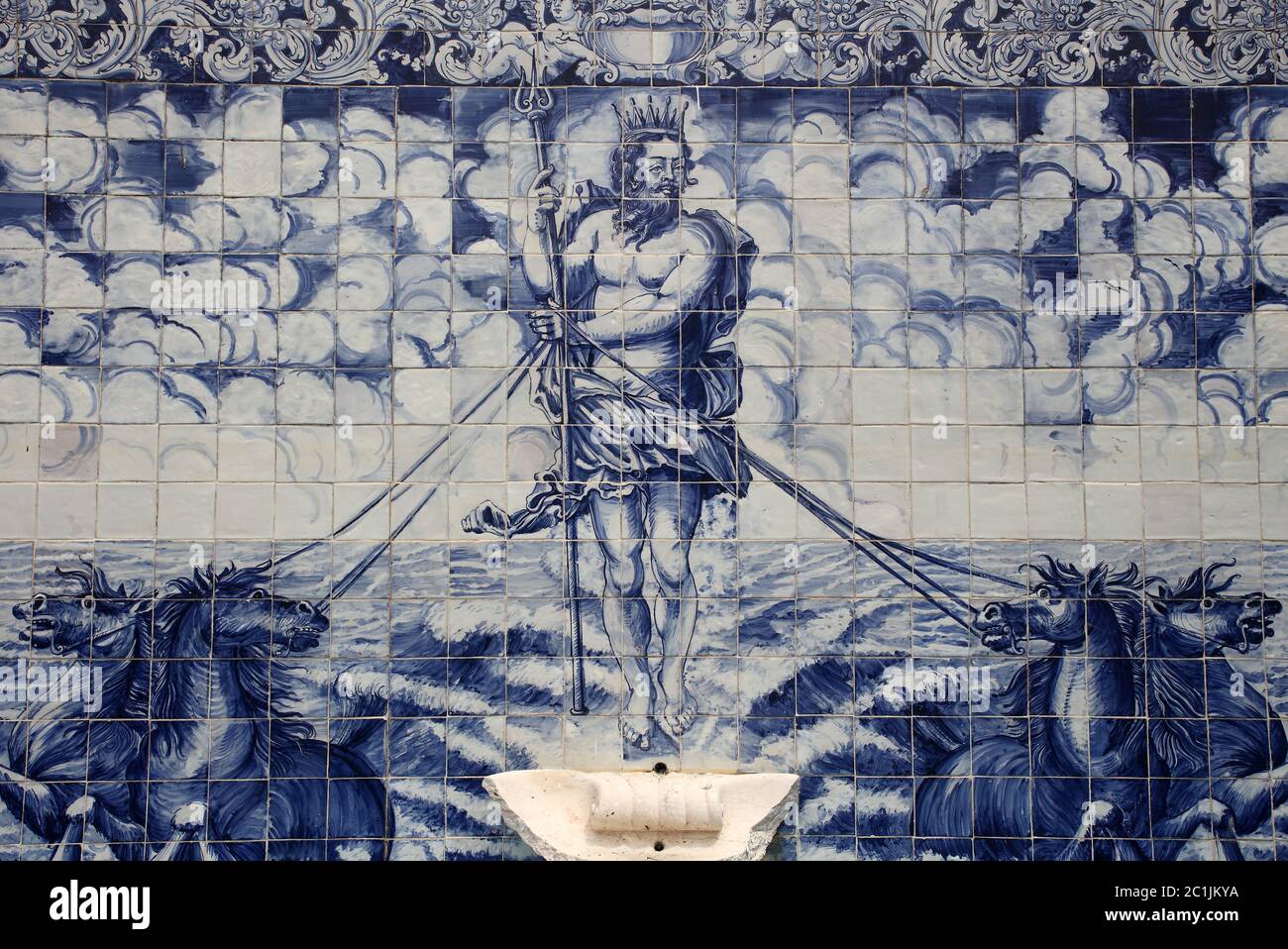 Fountain wall with historical, Portuguese, blue and white azulejo ceramic tiles depicting Neptune or Poseidon. Constancia, Santarem, Portugal. Stock Photo