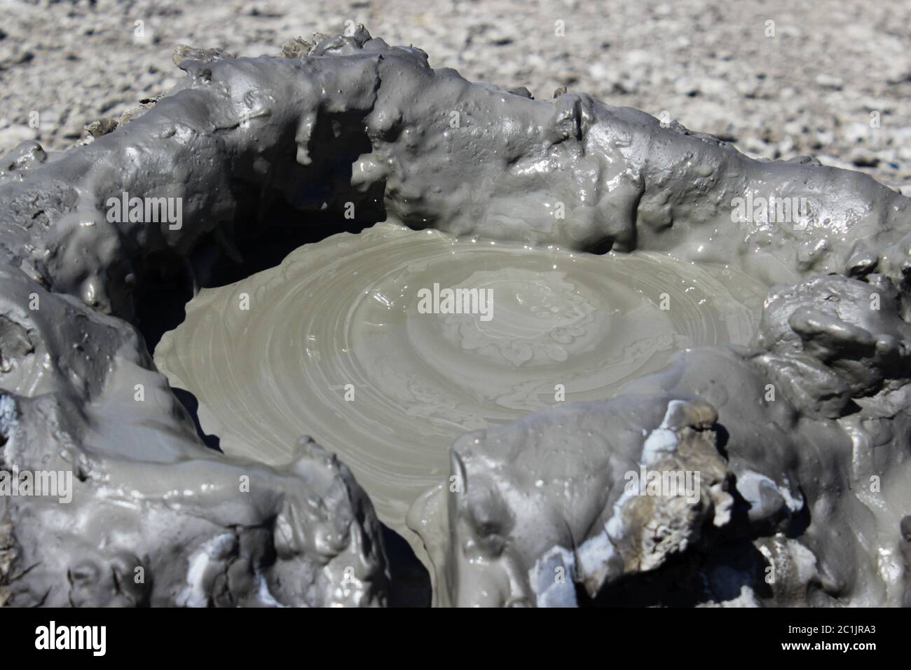 the top of a cold mud volcano, which is created as a result of the release of gas methane, nitrogen and carbon dioxide from the Stock Photo
