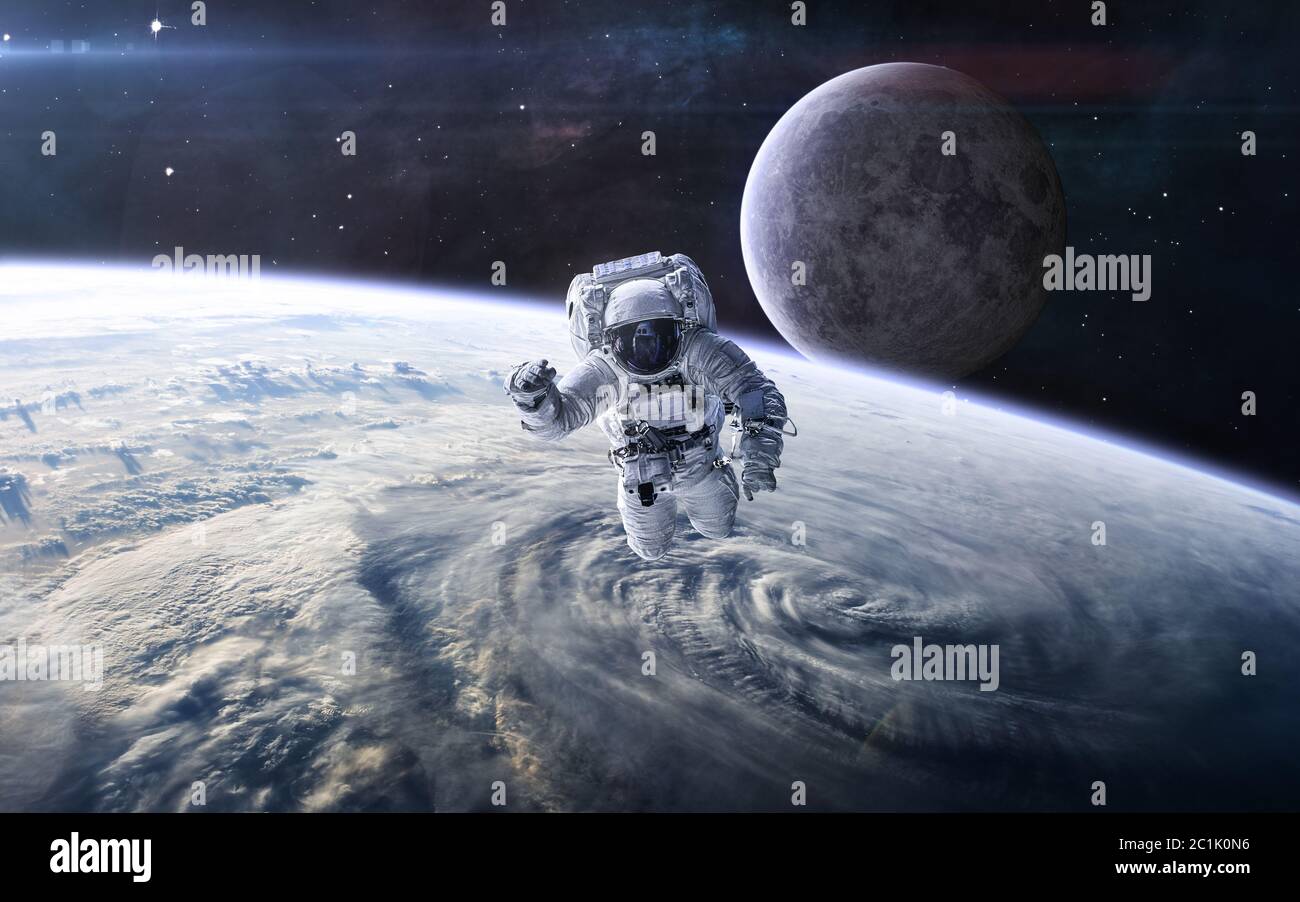 Astronaut moon with earth in background hi-res stock photography and ...