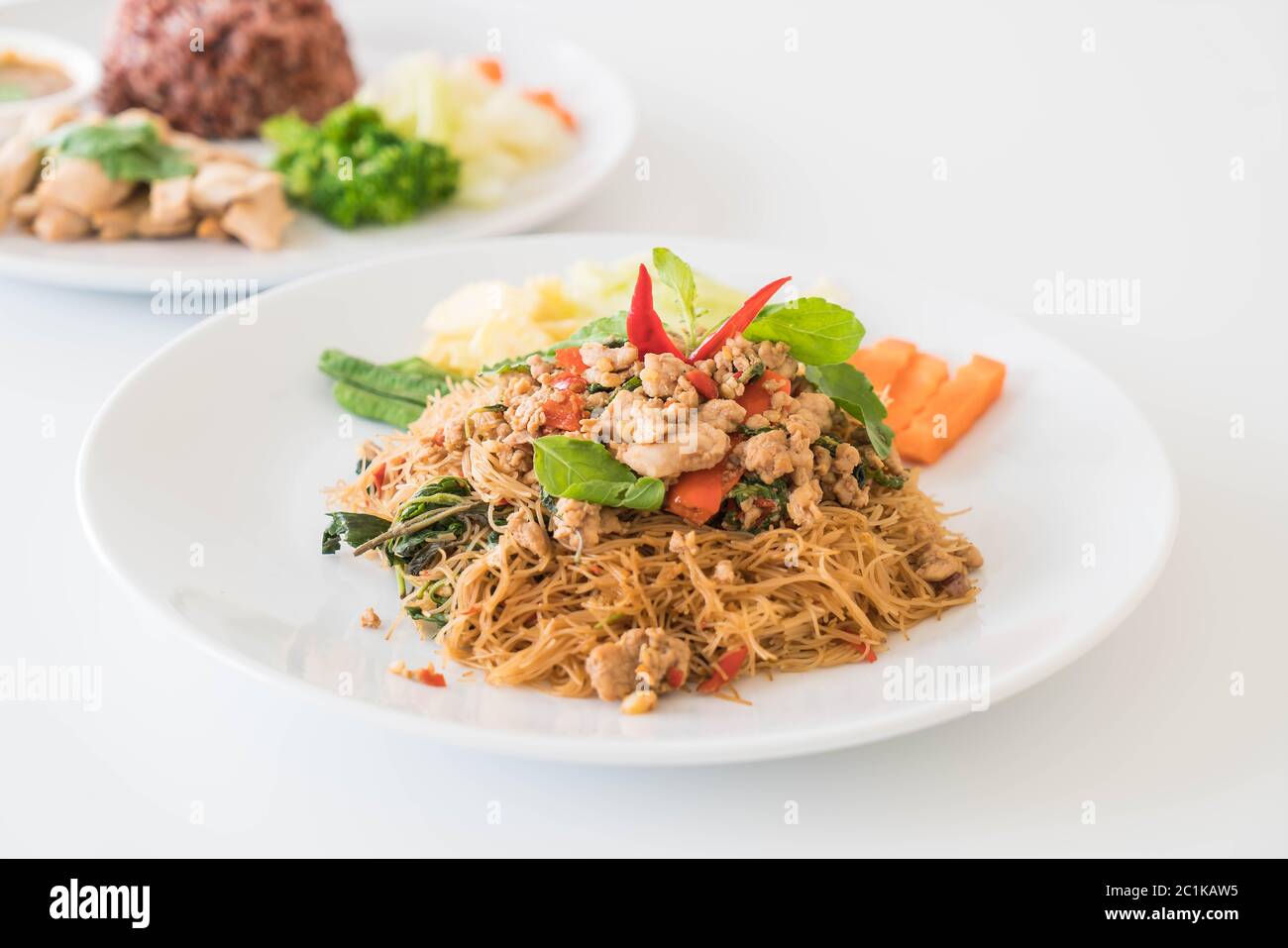 stir-fried noodle with pork and basil Stock Photo