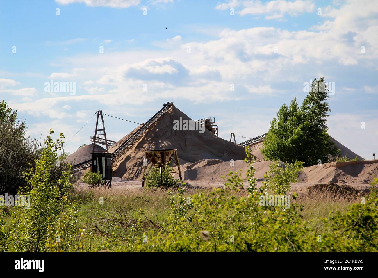 Details of a vibrator, gravel, conveyor belts, silos and heaps Stock Photo