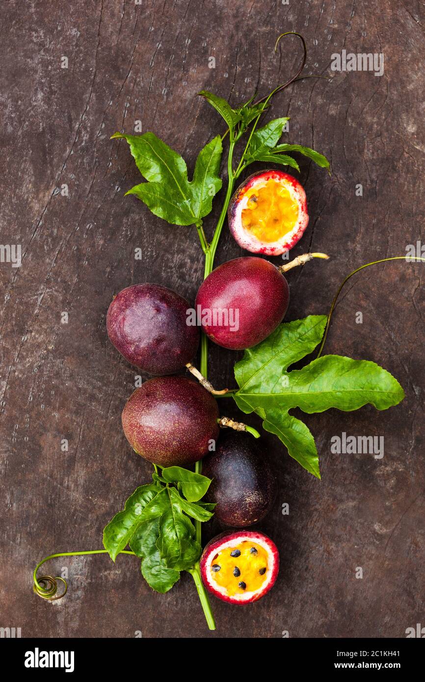 Passion fruits with leaves. Passiflora edulis Stock Photo