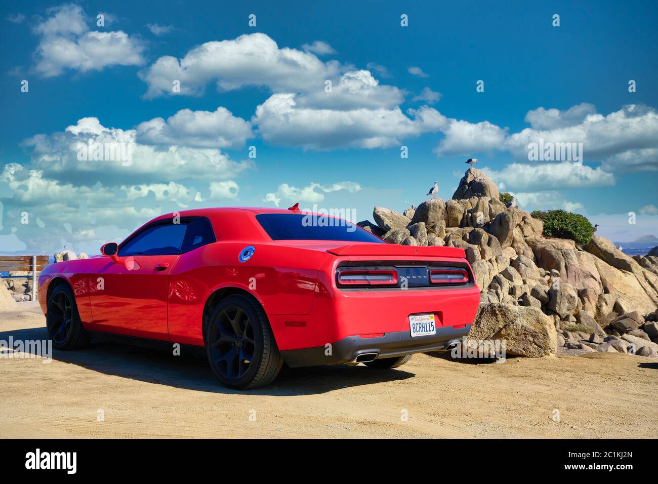 Red Dodge Challenger at Beach Stock Photo