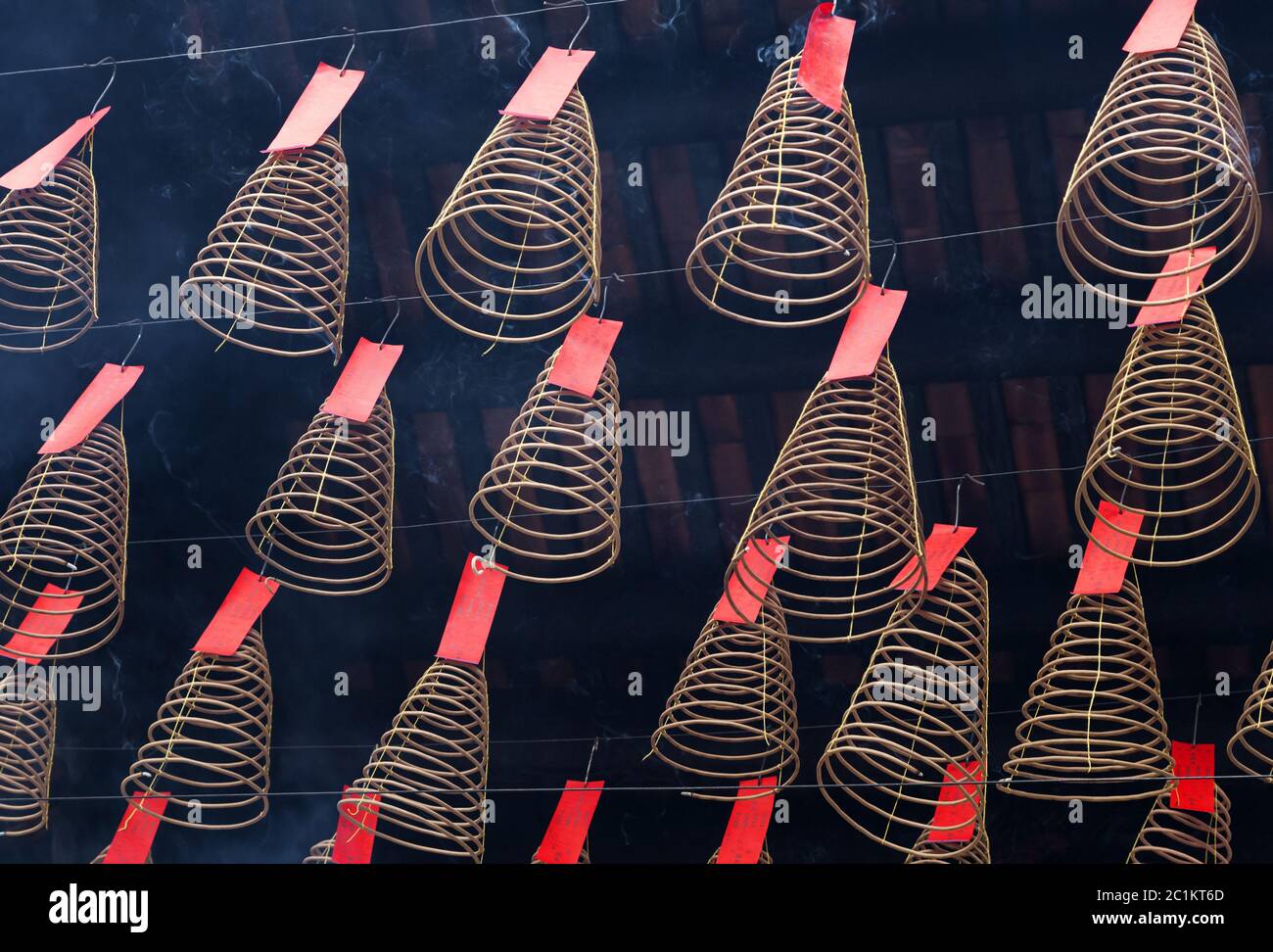 Spiral incense burning hanging in Vietnamese temple Stock Photo Alamy