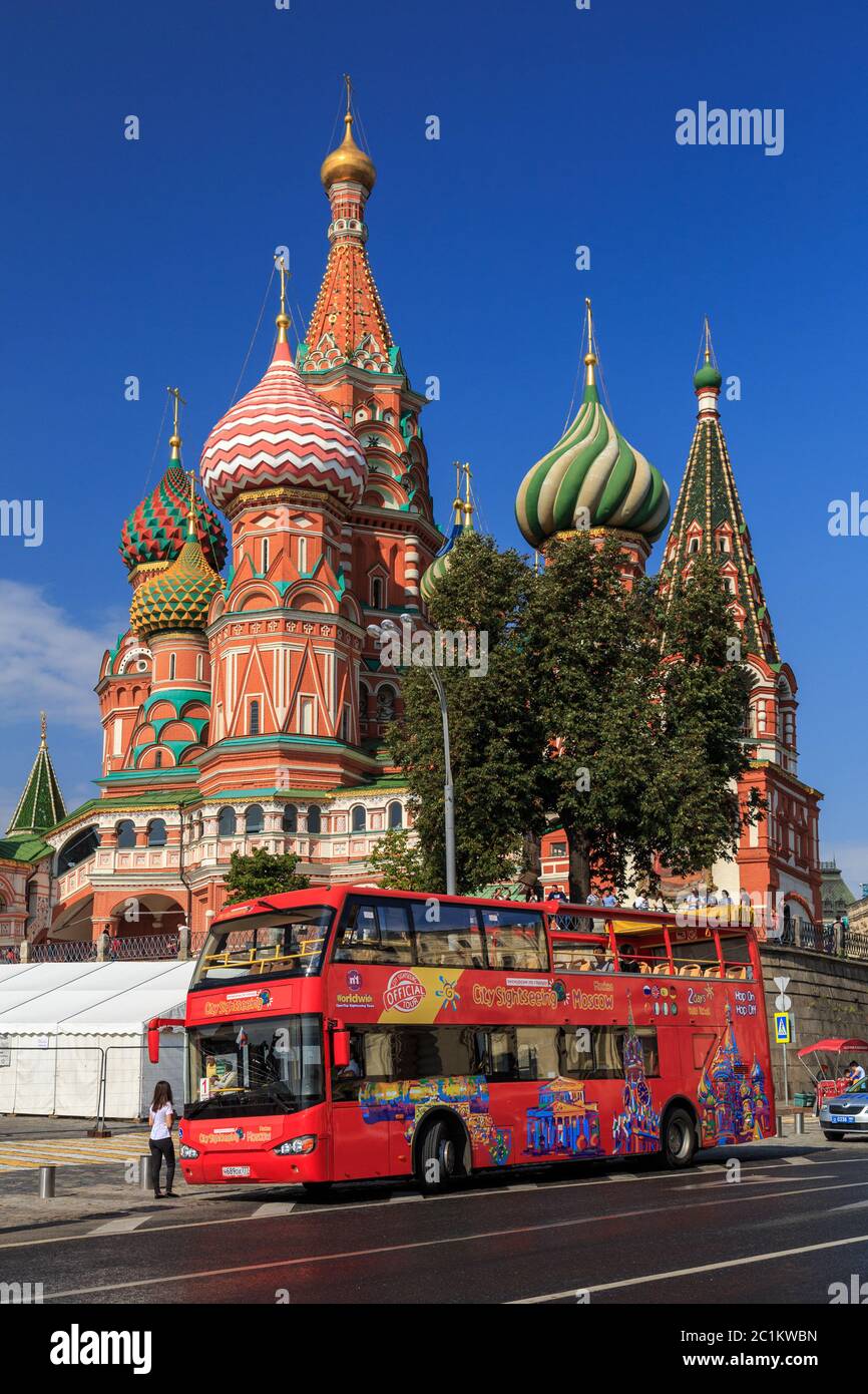 Moscow - September 4, 2018: Red tourist double-decker bus against the background of St. Basil Stock Photo