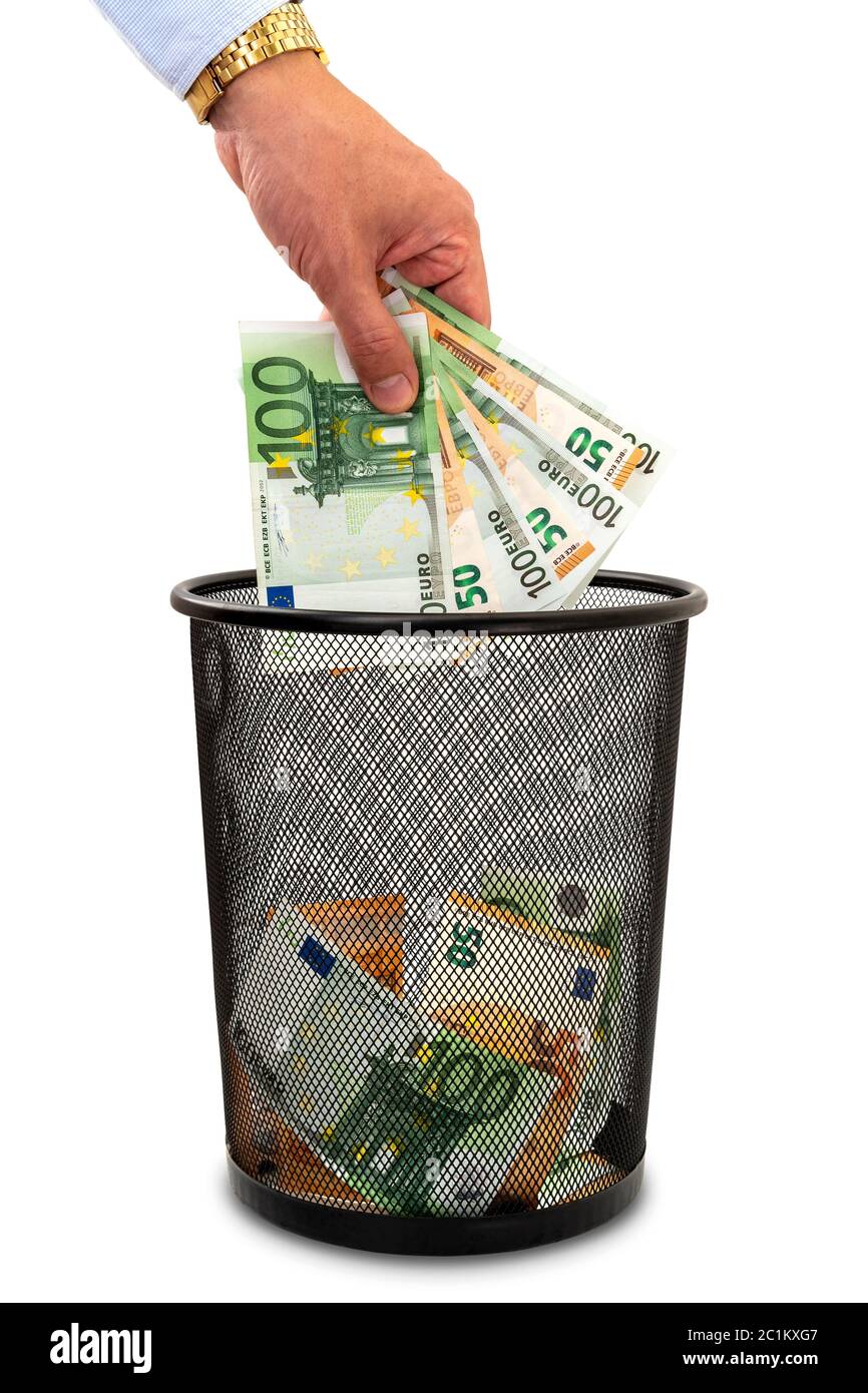 Throwing money away into the trash Stock Photo Alamy