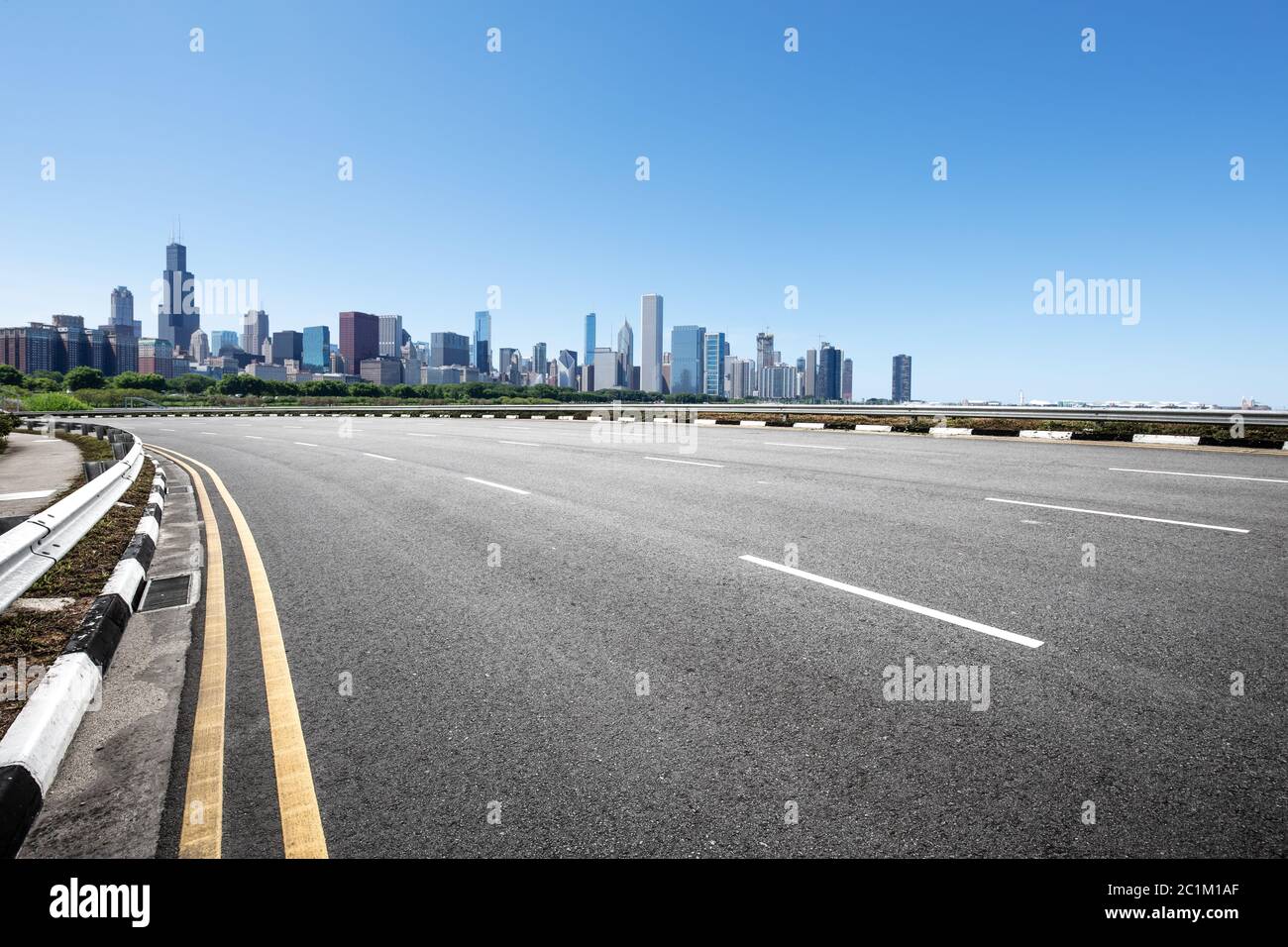 asphalt highway with modern city in chicago Stock Photo - Alamy