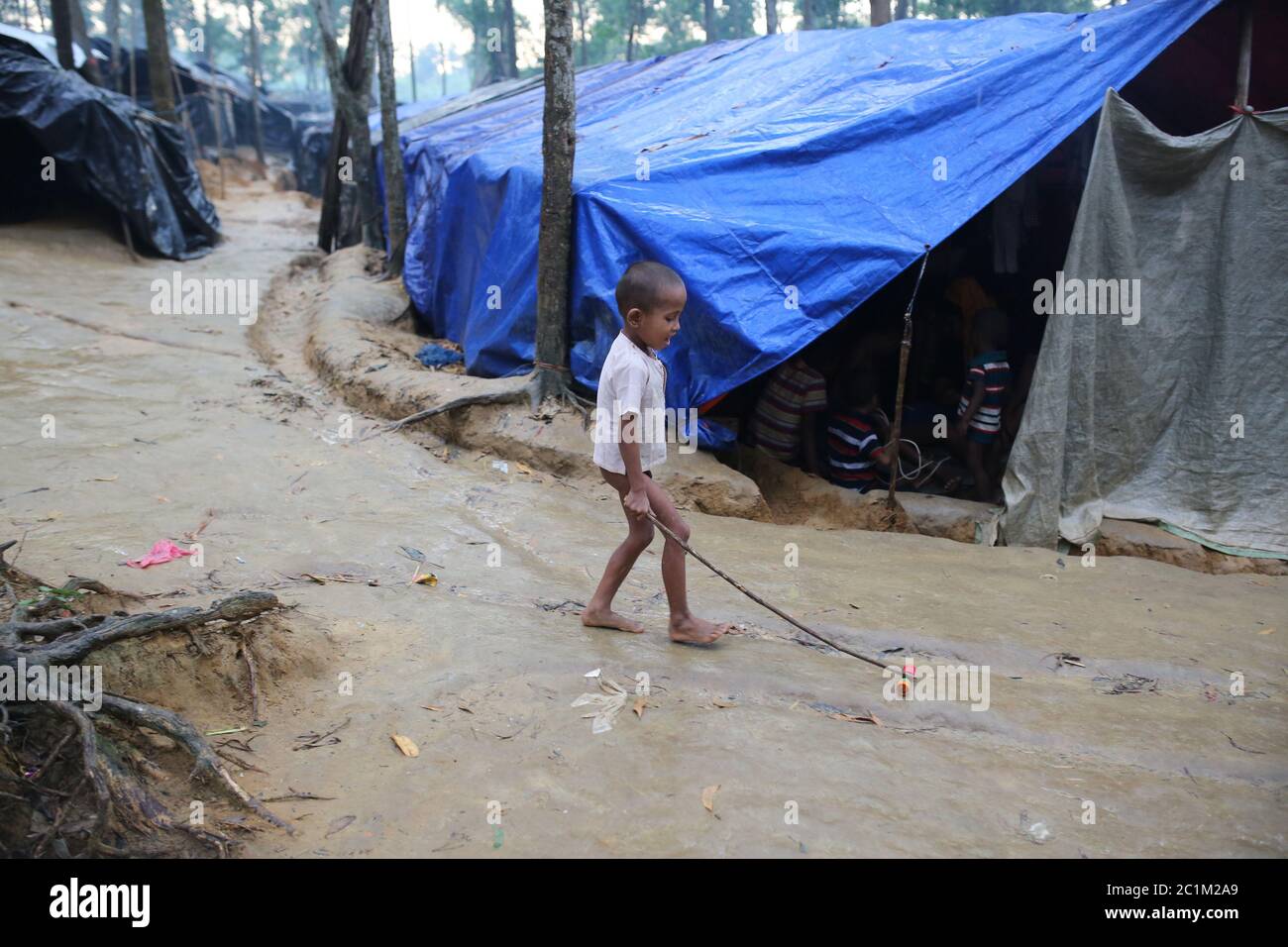 A Rohingya child play at Kutupalong refugee camp, Bangladesh, Tuesday, Oct. 03, 2017. Stock Photo