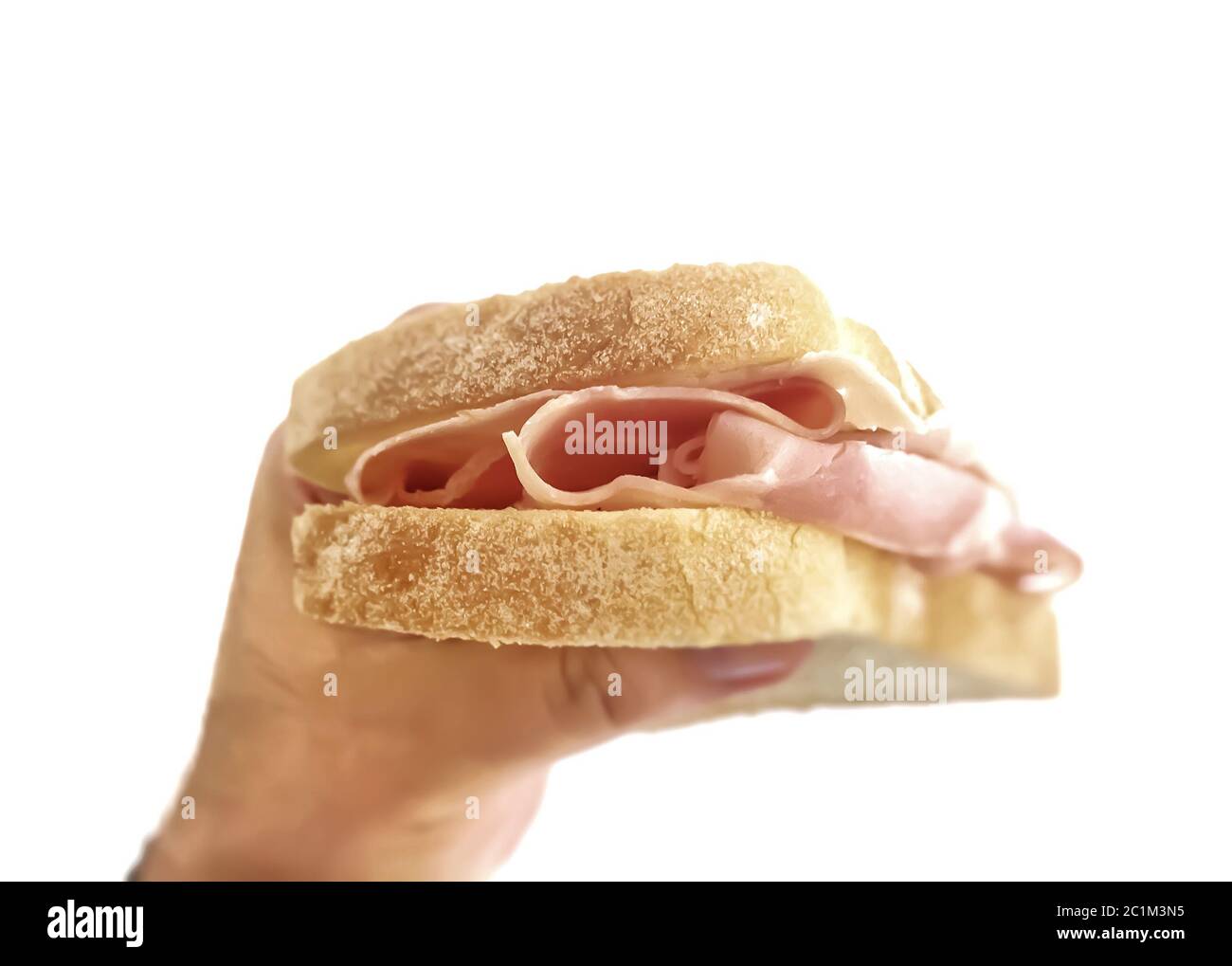 Male hand holding a baked ham sandwich Stock Photo Alamy