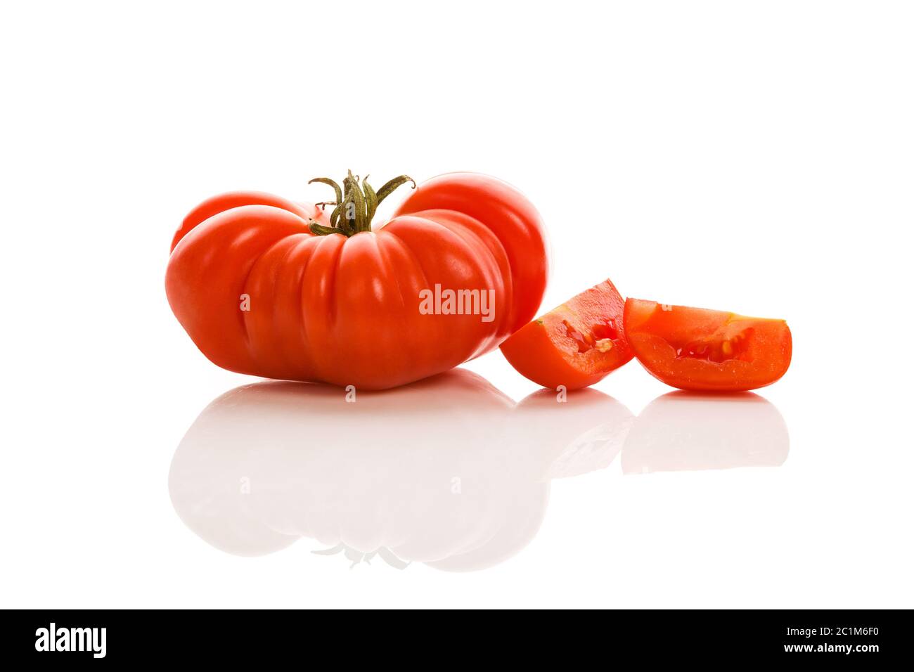 Whole tomato on white background. Stock Photo