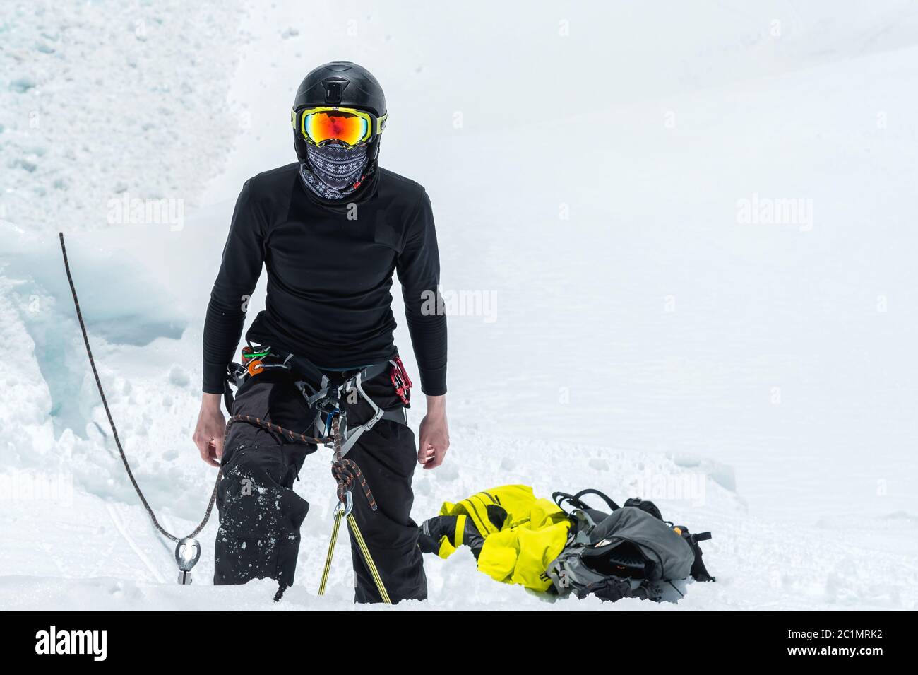 Mountain guide candidate training ice axe and rope skills on a glacier in the North Caucasus Stock Photo