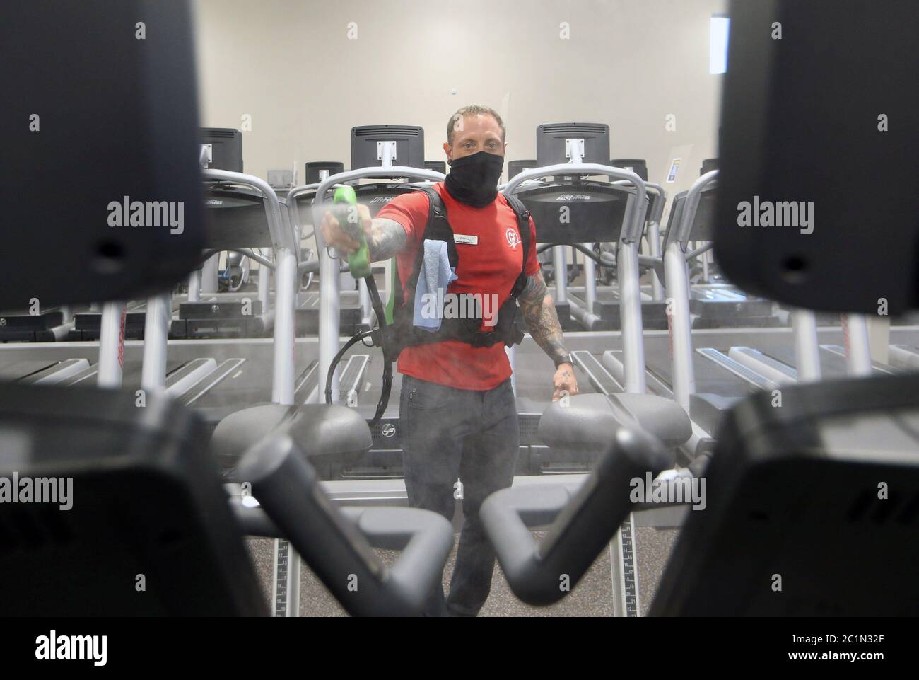 Maplewood United States 15th June Club Fitness Gym Employee David Watts Uses A Electro Magnetic Sprayer To Clean A Fitness Machine After Use On Day One Of Their Reopening In Maplewood