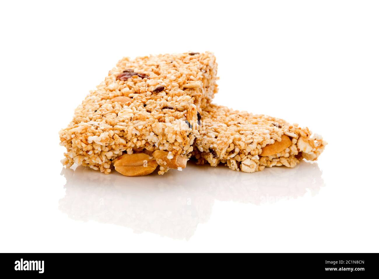 Healthy cereal granola bar with nuts and dry fruit isolated on white