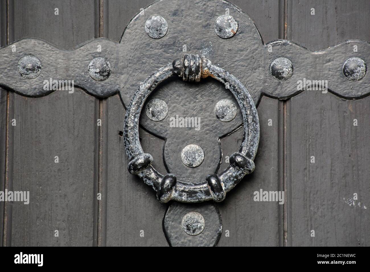 Historical old antique door handle close-up of a castle wooden door
