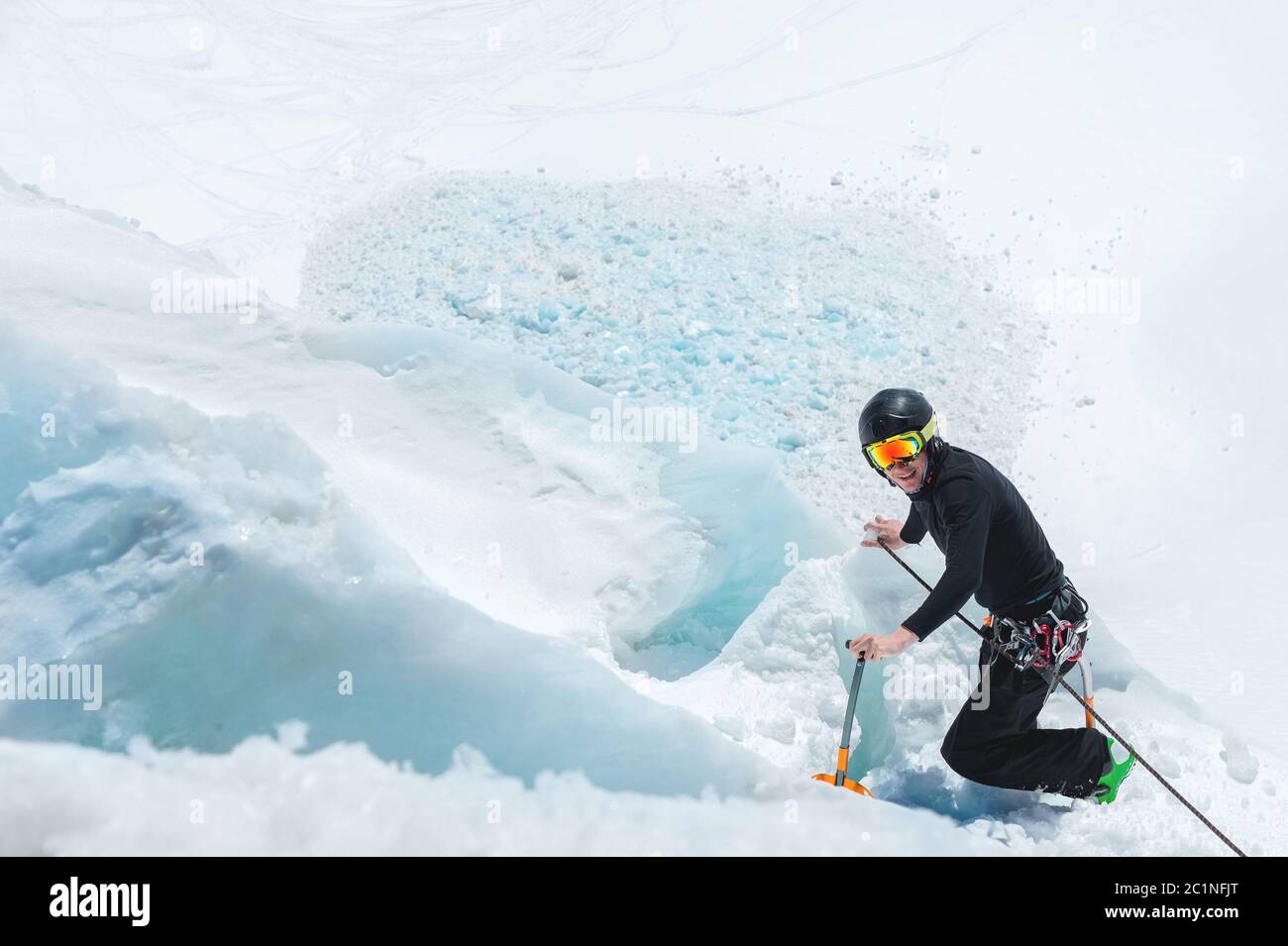 Mountain guide candidate training ice axe and rope skills on a glacier