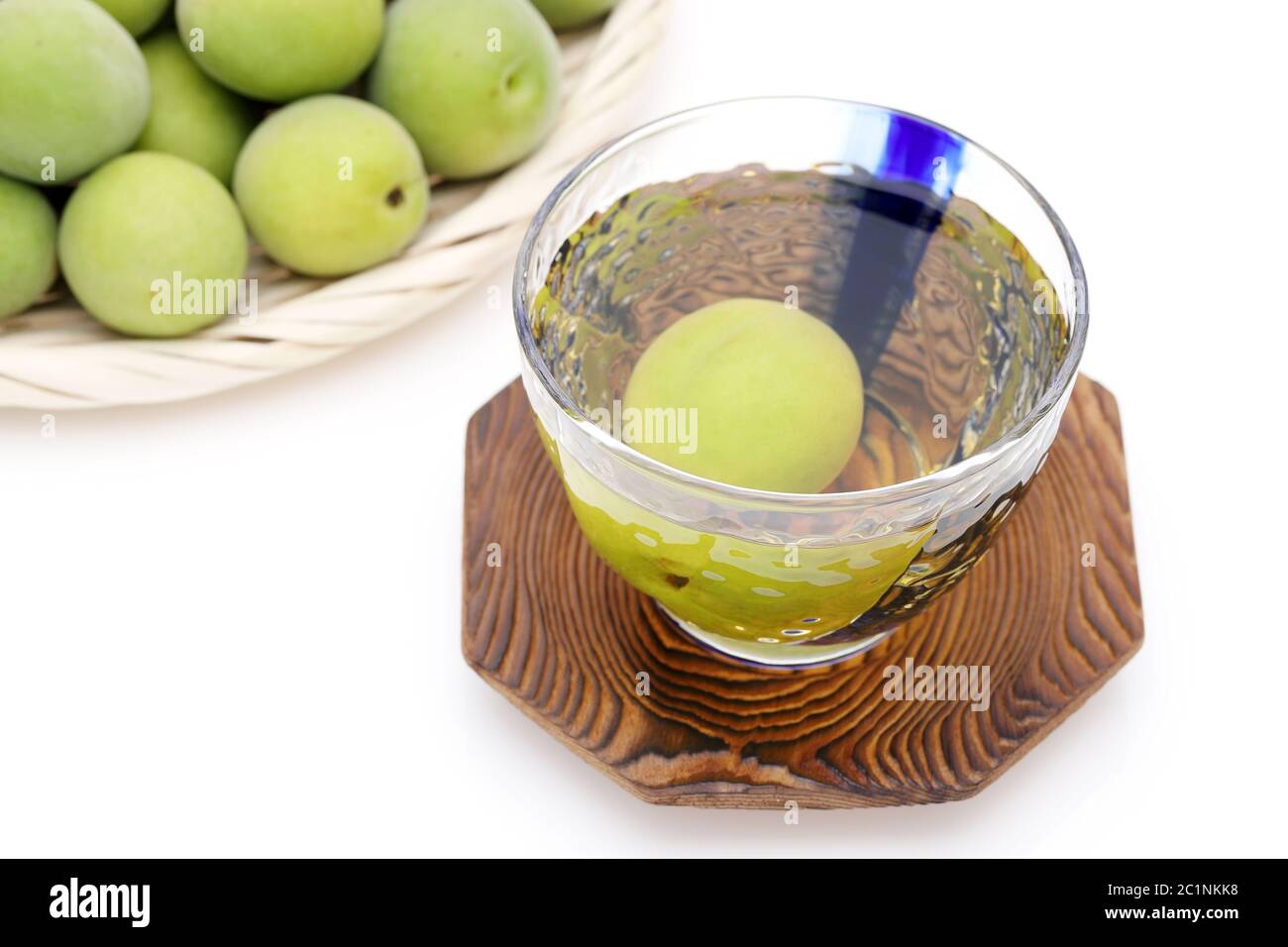 Japanese plum wine called umeshu on white background Stock Photo - Alamy
