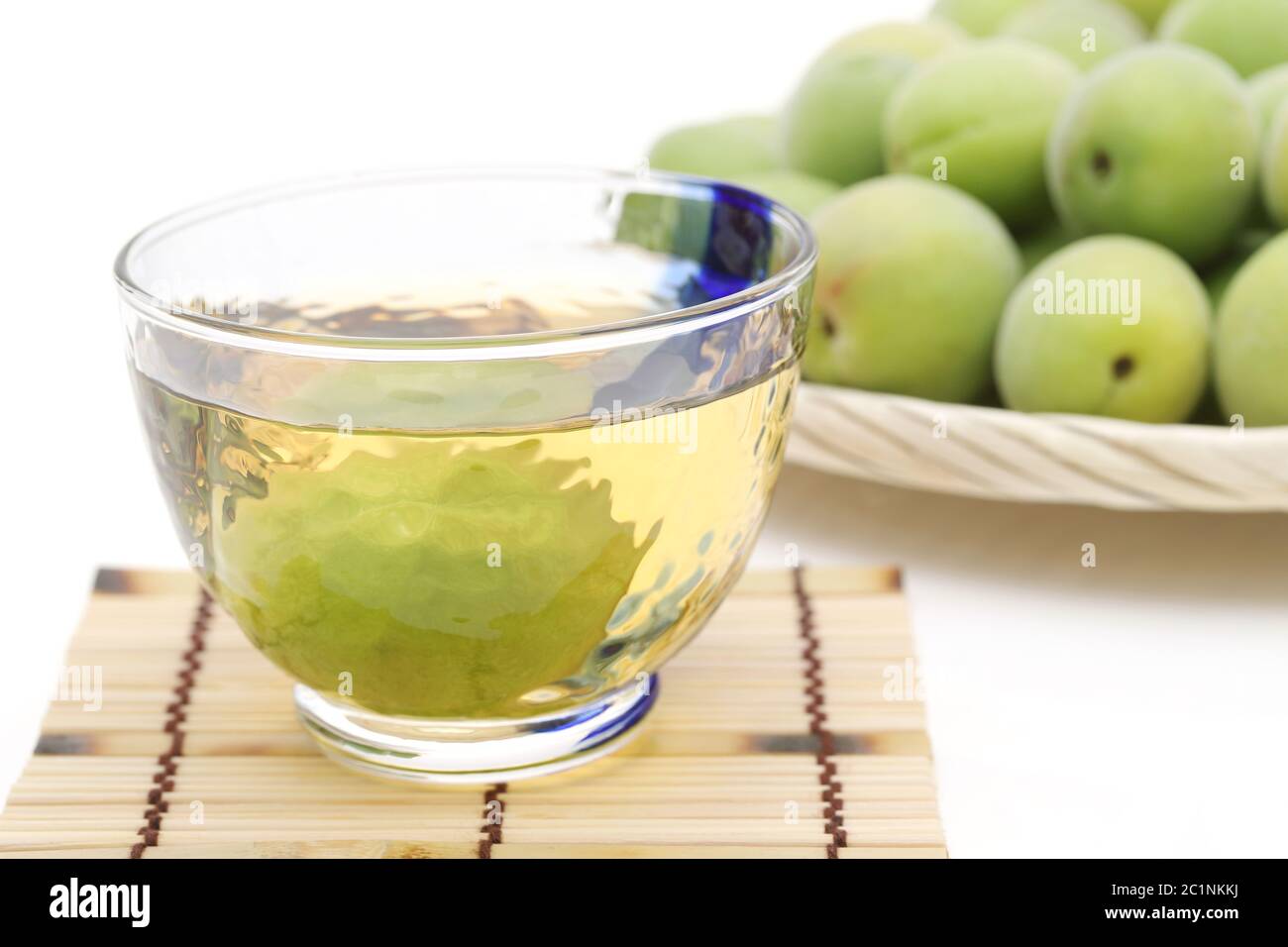 Japanese plum wine called umeshu on white background Stock Photo - Alamy
