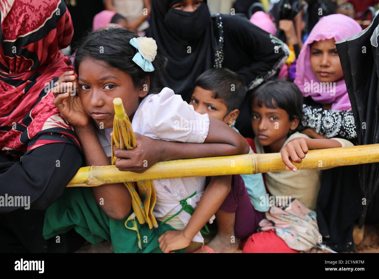 Rohingya people gather to collect food aid at Thangkhali refugee camp in Cox's Bazar, Bangladesh, Thursday, Oct. 5, 2017. Stock Photo