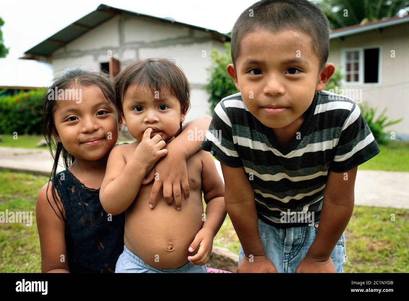 Close-up portrait of native Panamanian children looking at camera. Caribbean living on Isla Bastimentos, Bocas del Toro Province, Panama. Oct 2018 Stock Photo