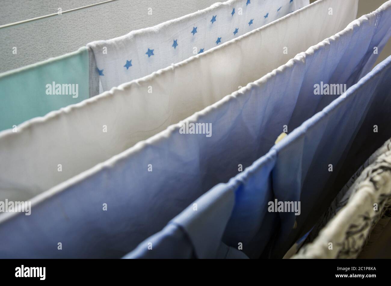 Laundry drying on a clotheshorse Stock Photo