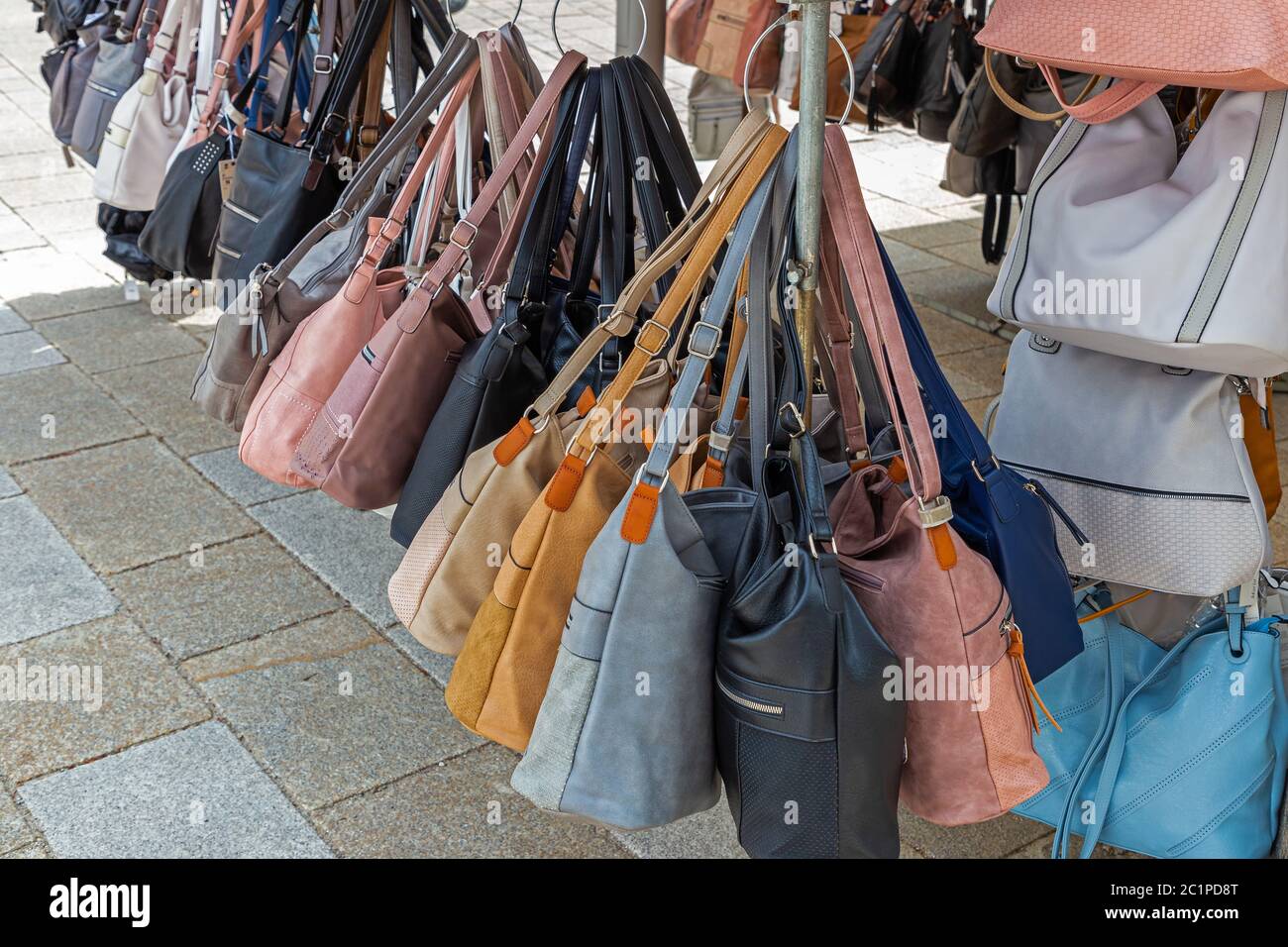 handbags for sale at a market stall in germany 2C1PD8T