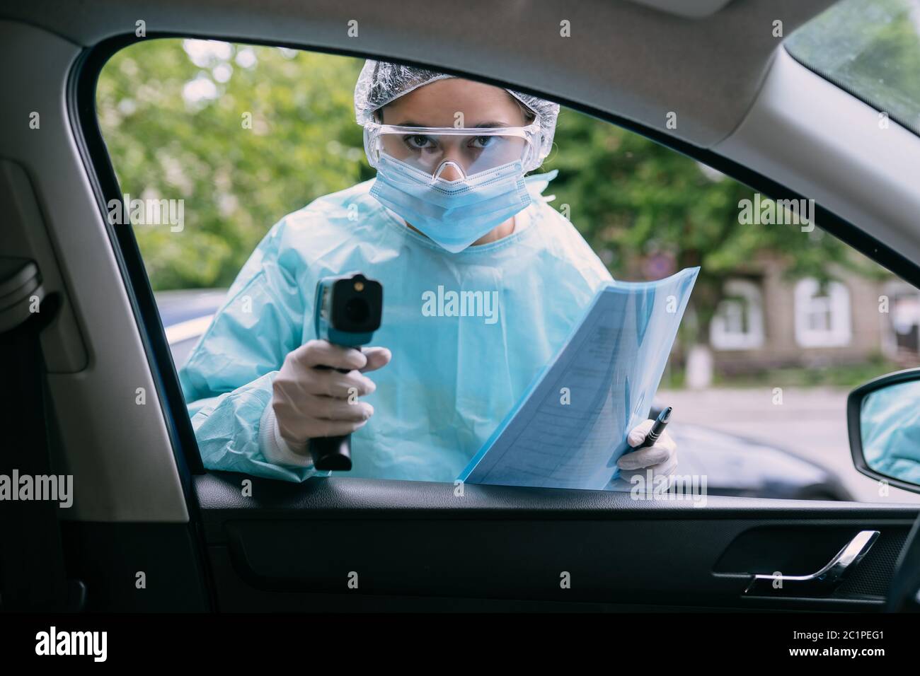 Doctor woman use infrared thermometer gun to check body temperature ...