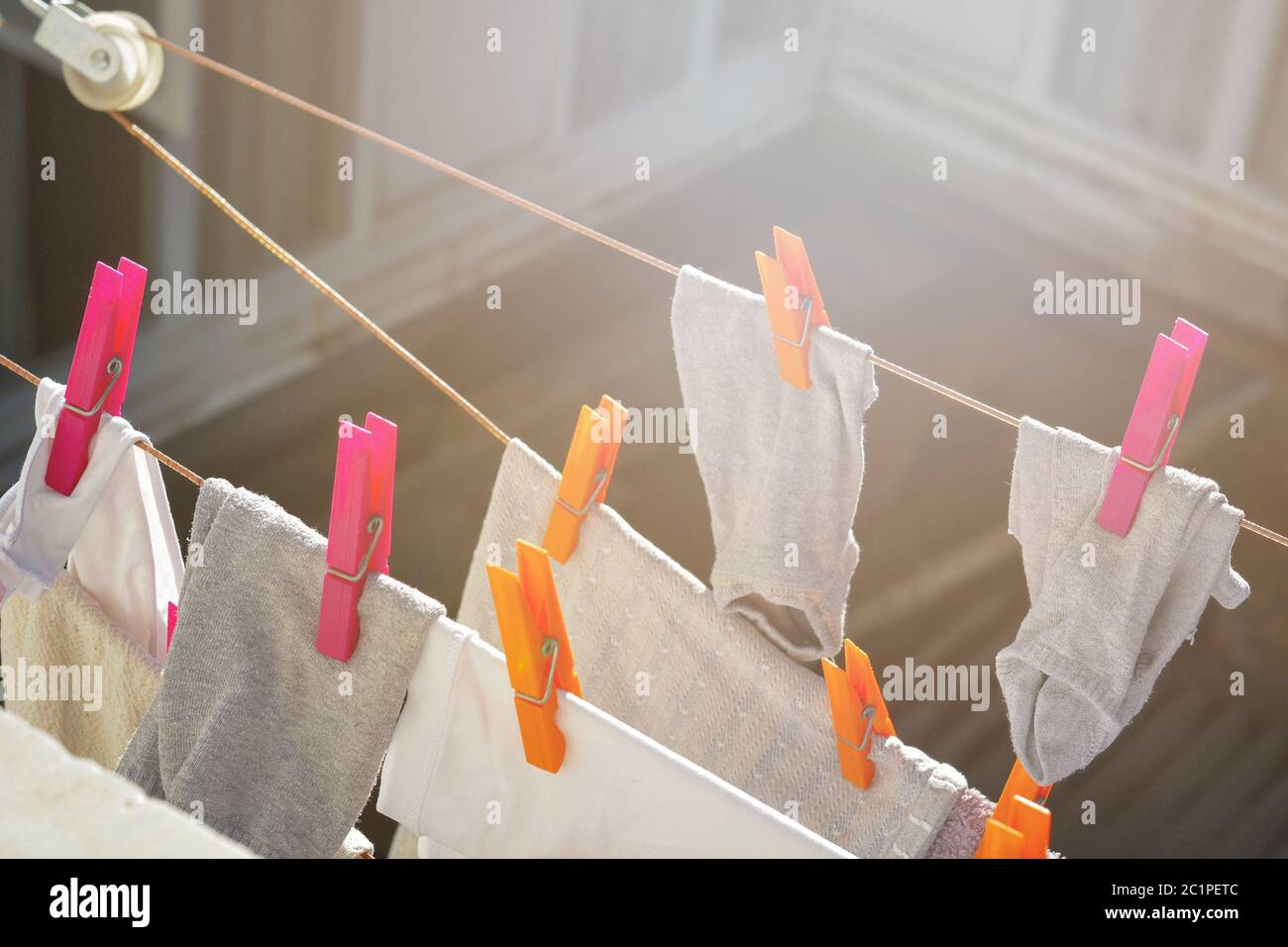 Laundry hanging on clothes line to dry Stock Photo