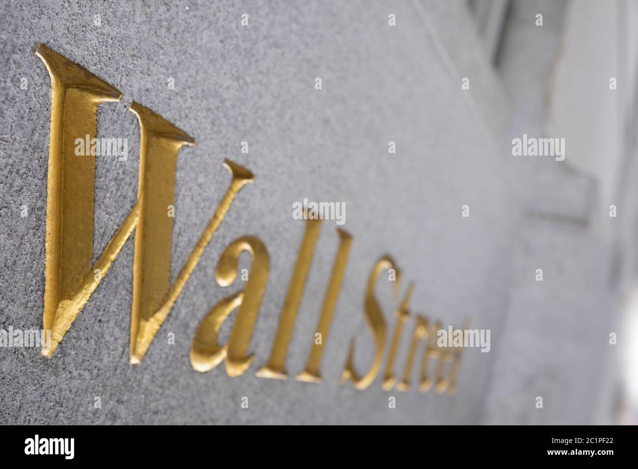 Close up of Wall street in golden letters embedded in a wall in financial district, Manhattan. Copy space Stock Photo