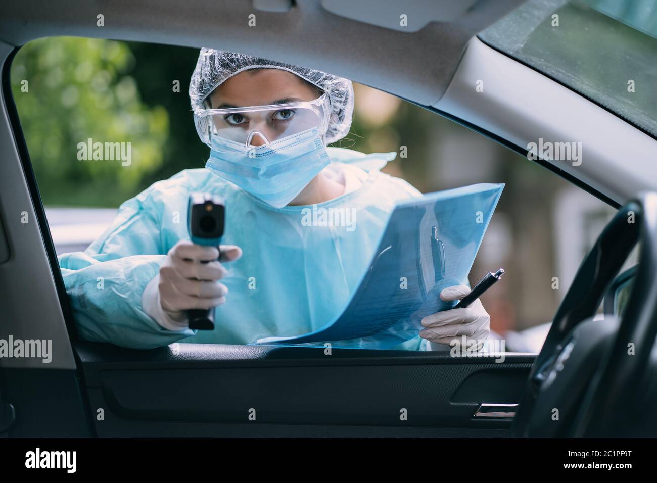 Doctor woman use infrared thermometer gun to check body temperature ...