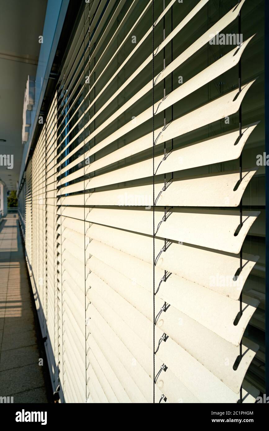 Venetian blind as a sunscreen on the window of an office building in Berlin Stock Photo