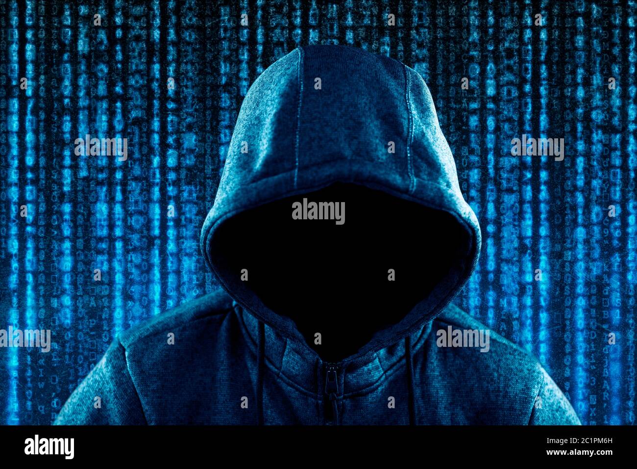 Anonymous hooded computer hacker portrait on computer code background Stock Photo