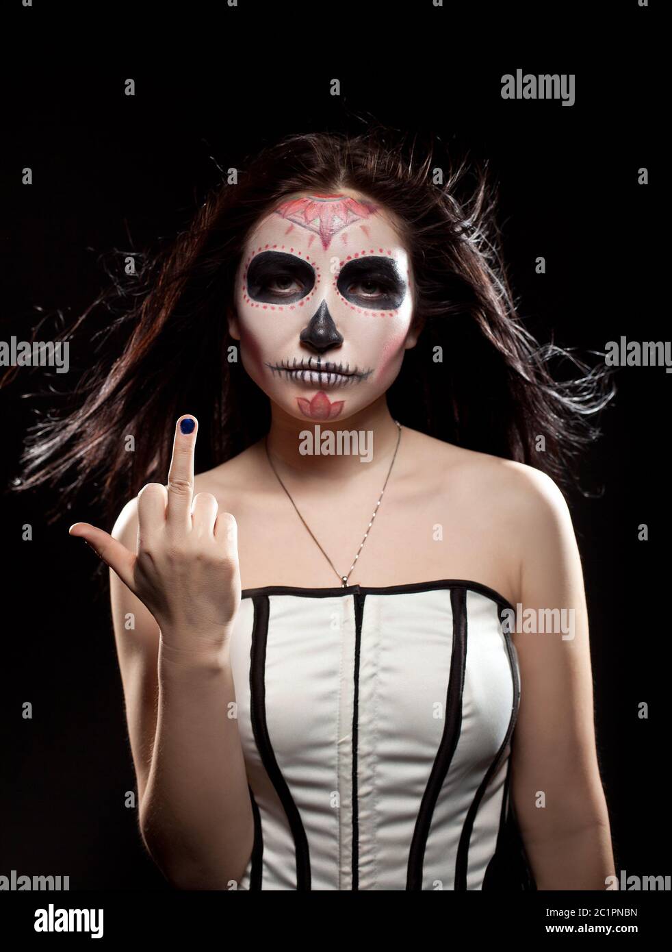 Young woman in day of the dead mask skull face art Stock Photo